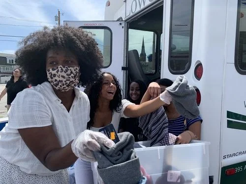 Volunteers loading donated clothing during a Northeast Christian Church community outreach