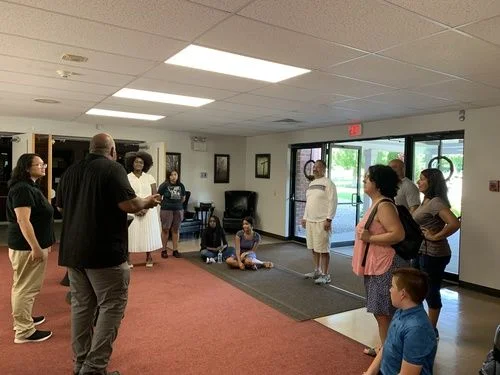 Volunteers gathering for a Northeast Christian Church serve team orientation